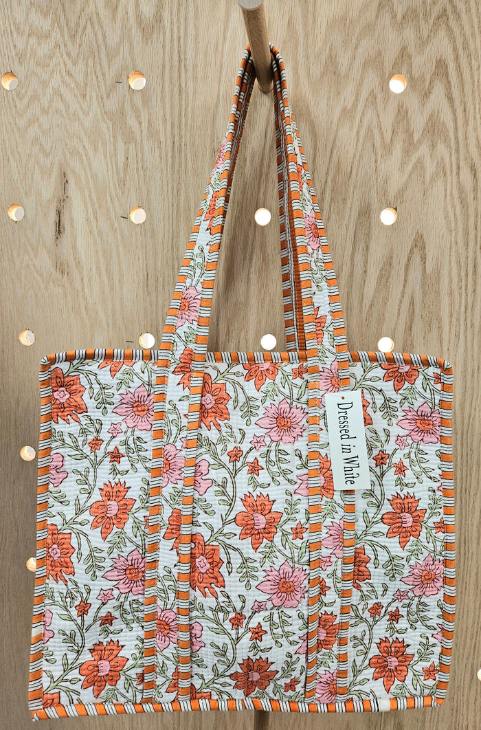 orange floral print quilted bag