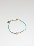 Aqua beaded bracelet with a pearl in the center