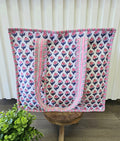 pink and blue quilted bag