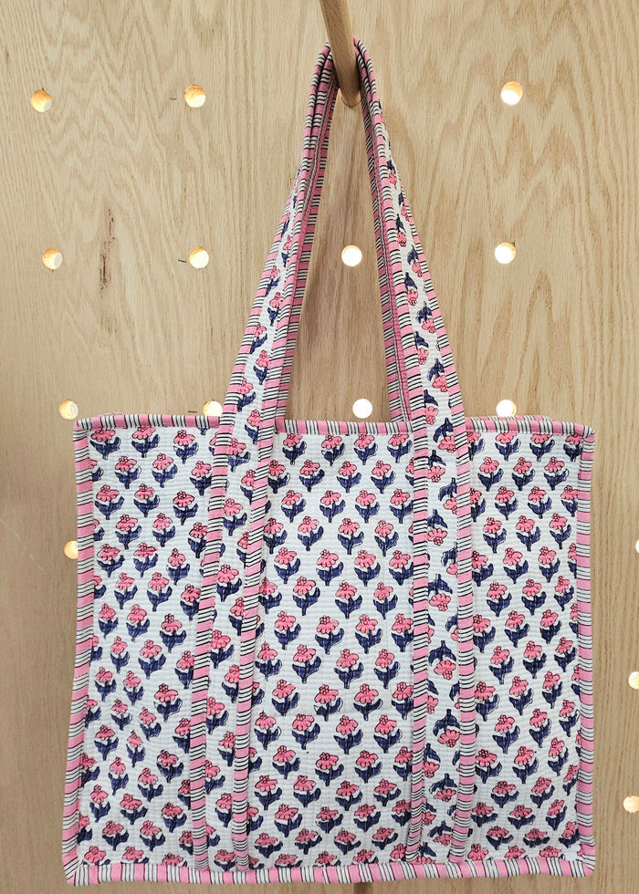 pink and blue quilted bag
