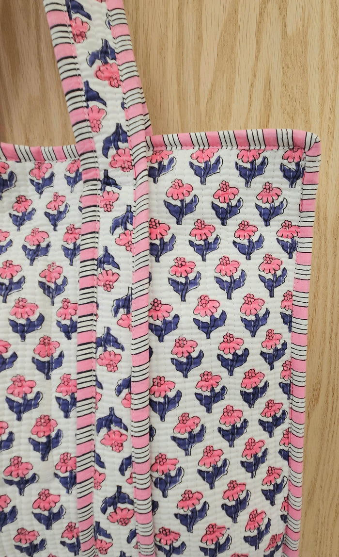 pink and blue quilted bag