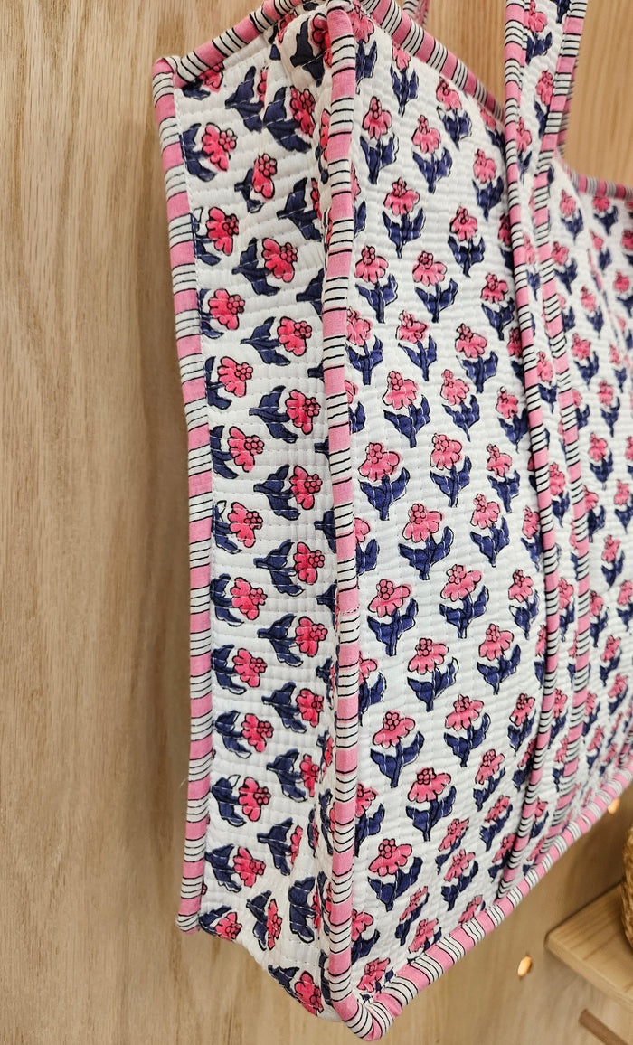 pink and blue quilted bag