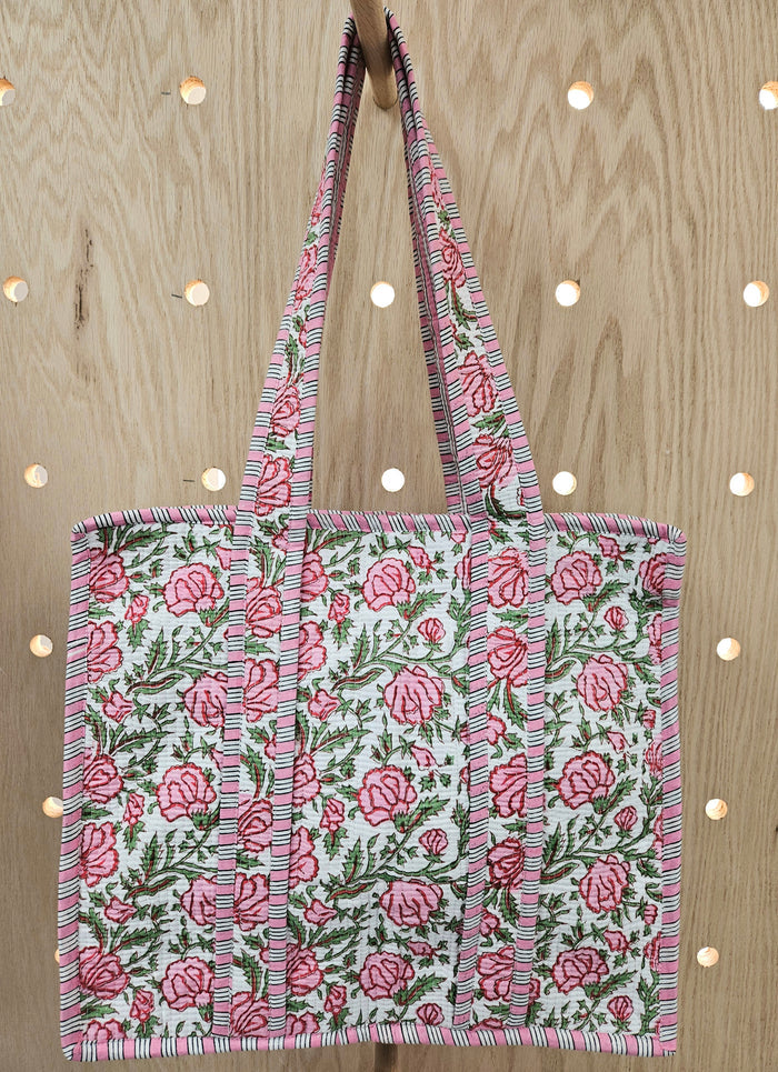 pink quilted bag with handle