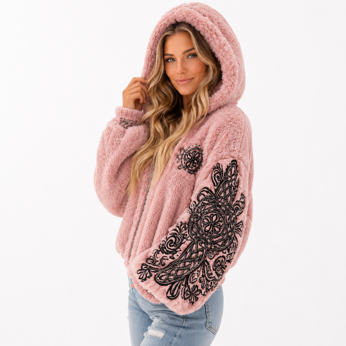 Pink hooded jacket styled for snow days with casual jeans and layered jewelry