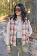 Women's quilted puffer vest in taupe, brown, persimmon orange and green plaid by Easel