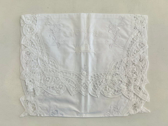 White cotton envelope with embroidery.