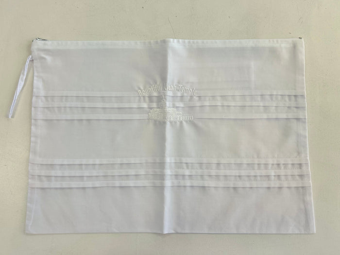 White cotton envelope with embroidery.