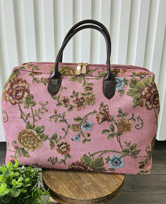 Pink carpet bag.