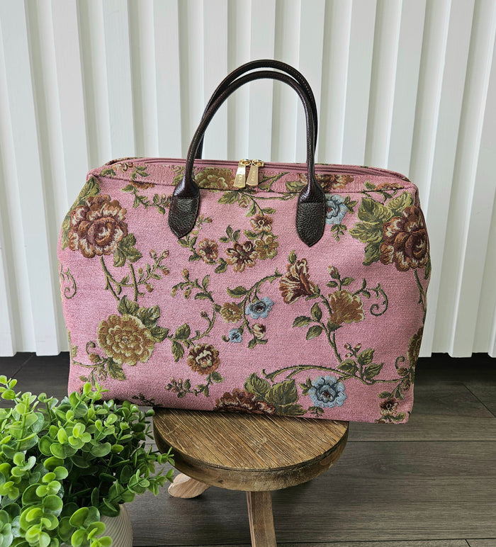 Pink carpet bag.