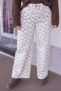 Women's cream denim pants with mocha and olive floral print by Wishlist