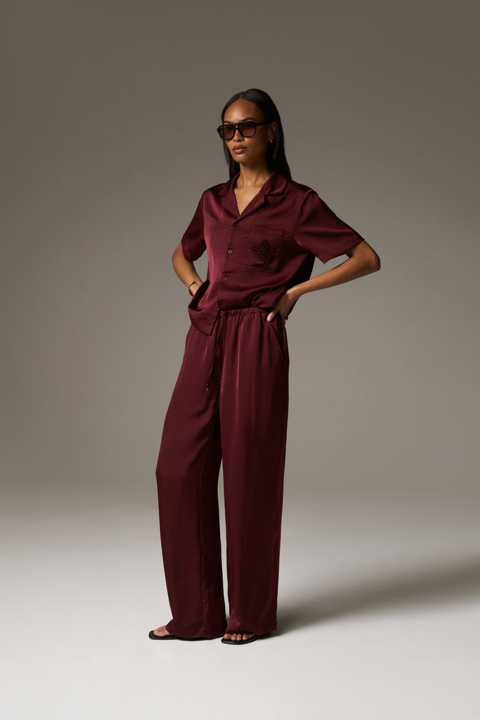 SATIN WIDE LEG EMBLEM TROUSERS - BURGUNDY