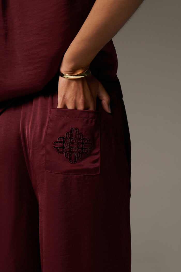 SATIN WIDE LEG EMBLEM TROUSERS - BURGUNDY