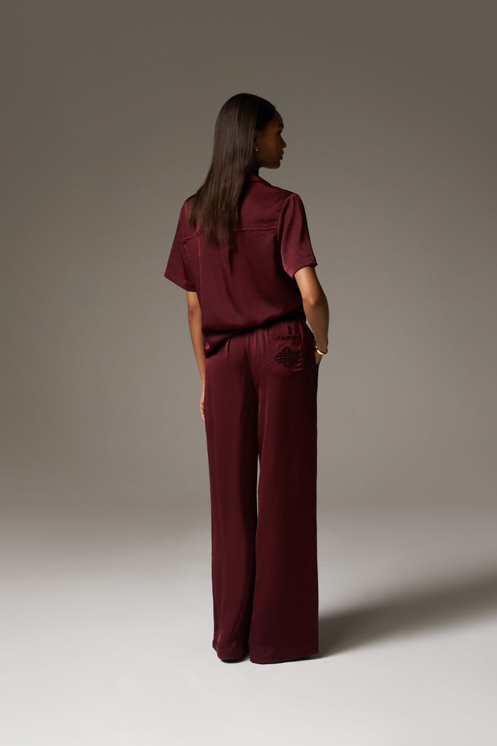 SATIN WIDE LEG EMBLEM TROUSERS - BURGUNDY