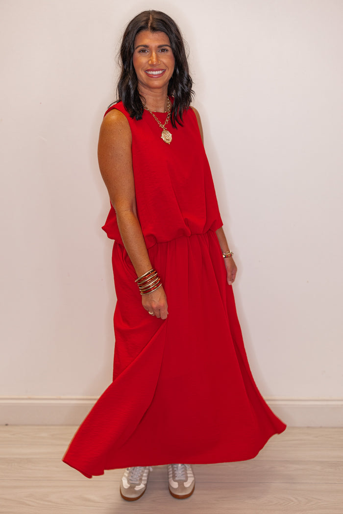 Women's red textured midi skirt with pleats by Entro shown with matching top