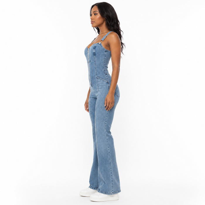 Front view of sleeveless denim jumpsuit with zip front, paneled patchwork design, full length and clean regular fit for women