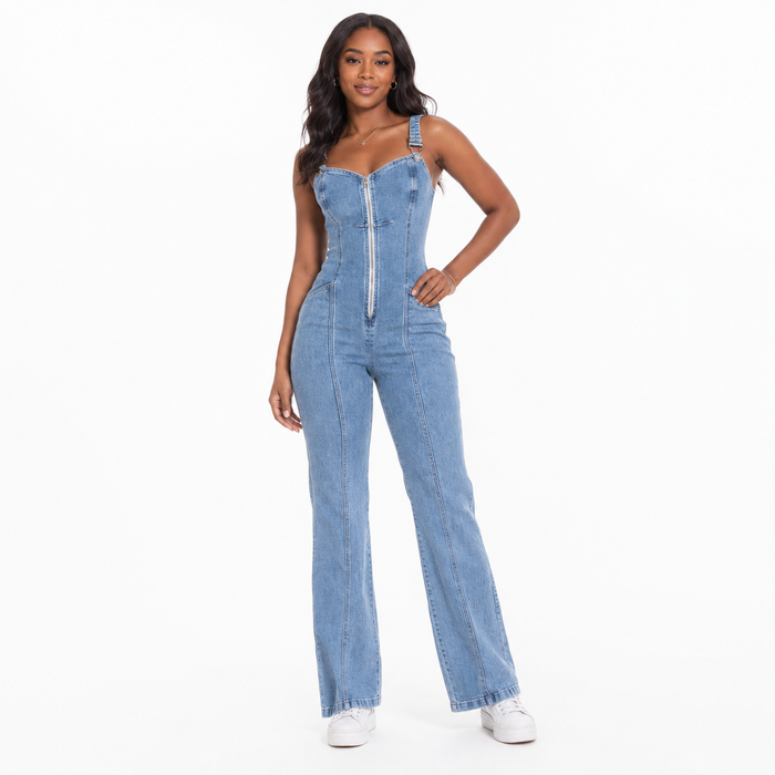 Women's sleeveless denim jumpsuit viewed from the side with zip front, structured panels and a full-length regular silhouette