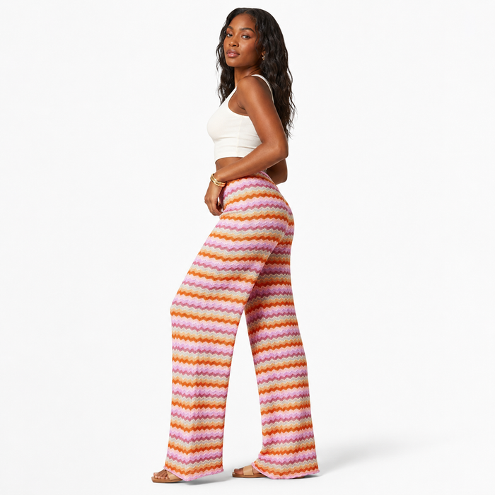 Color block wide leg pants with a full-length silhouette, conventional weight and bold patterned streetwear appeal for women.