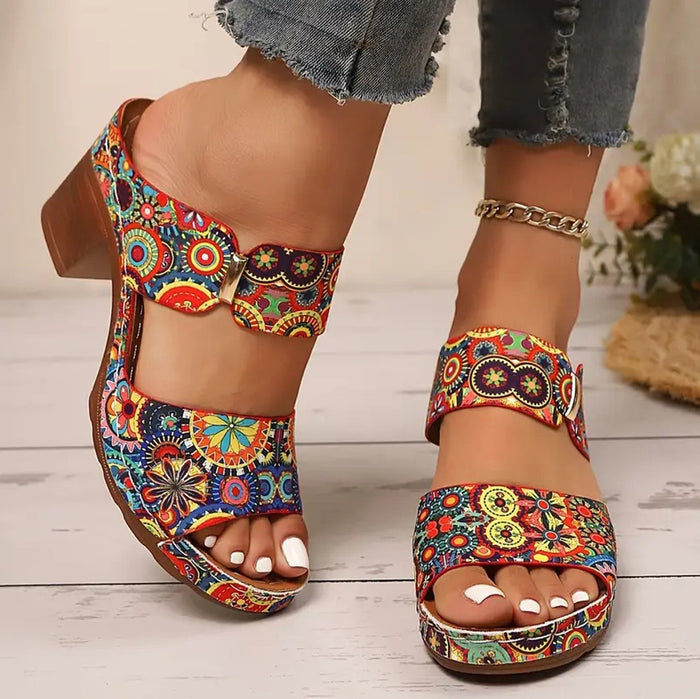 Buckle slide sandals for women with bold print, round open toe and buckle detail, presented for casual summer outfit styling.