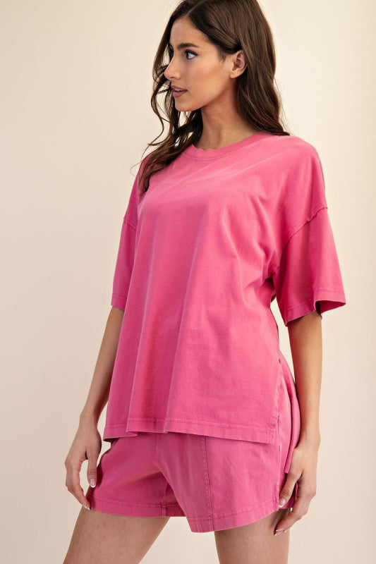 Women's oversized top in mineral washed french pink by Rae Mode showing slight side view