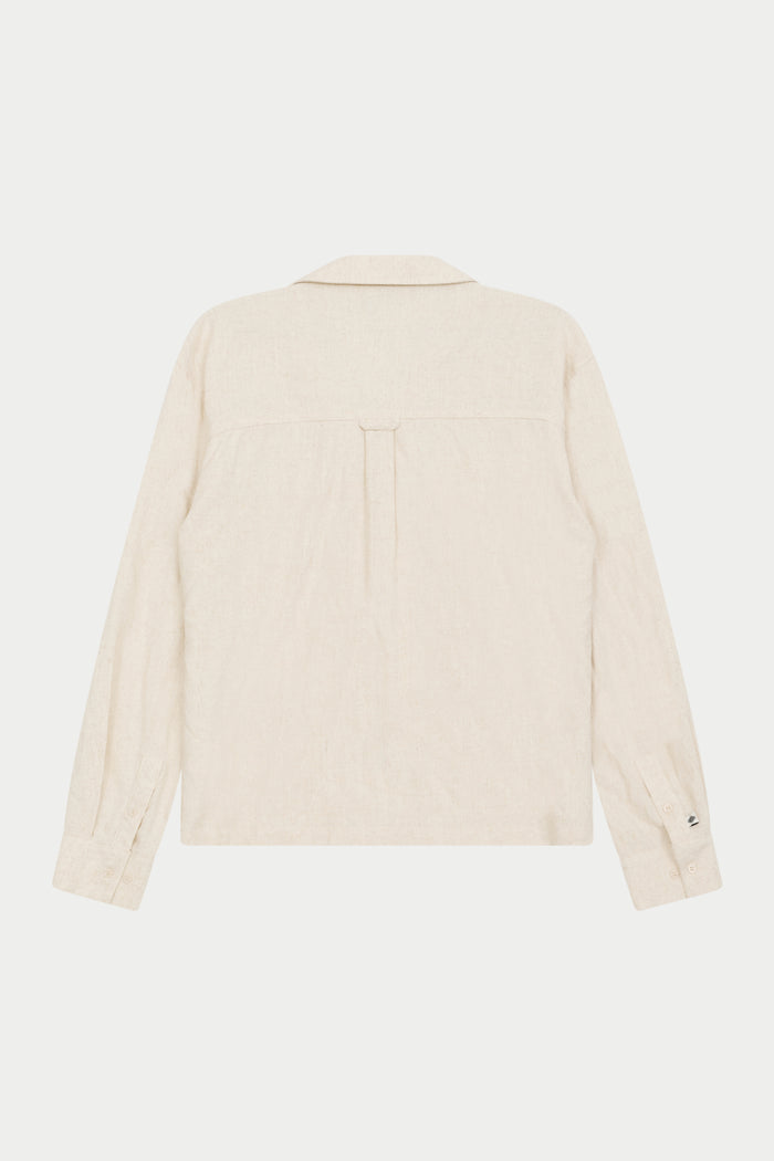 Back image of a  beige long-sleeved woven shirt with a revere collar against a plain background.