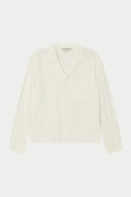 A white, long-sleeved, relaxed fit woven shirt with a revere collar and an oversized chest pocket, displayed on a plain background.