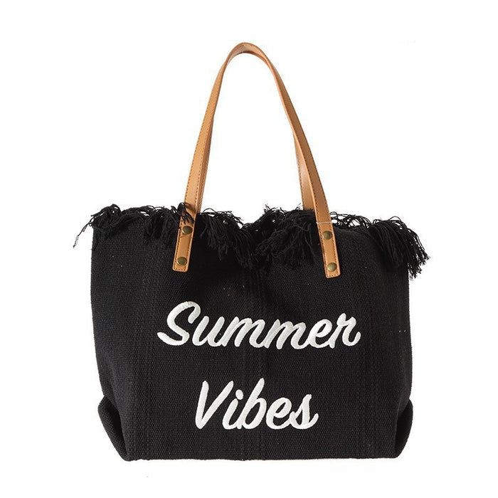 Top view flat lay of travel tote bag with magnetic closure, showing interior laptop compartment