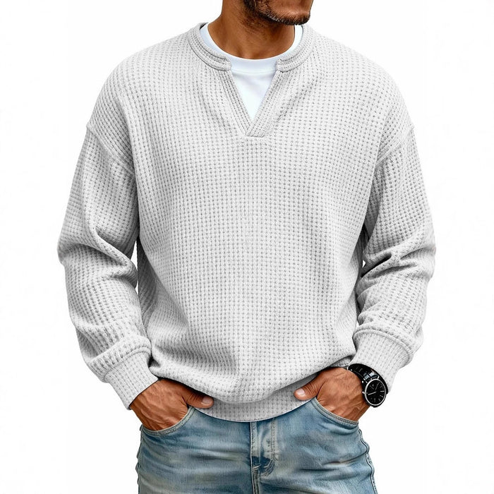 Side view of a men’s waffle knit long sleeve with a simple relaxed shape