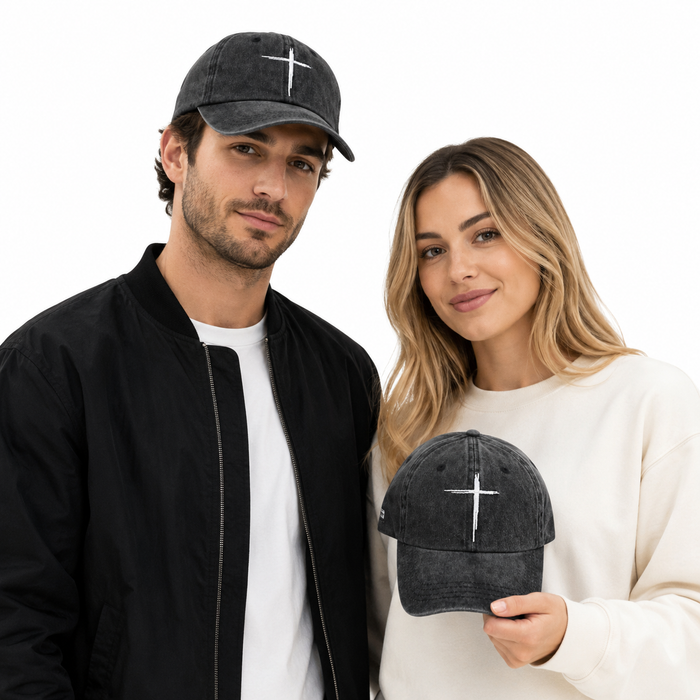 Man and woman wearing black baseball caps with a white cross symbol on a white background