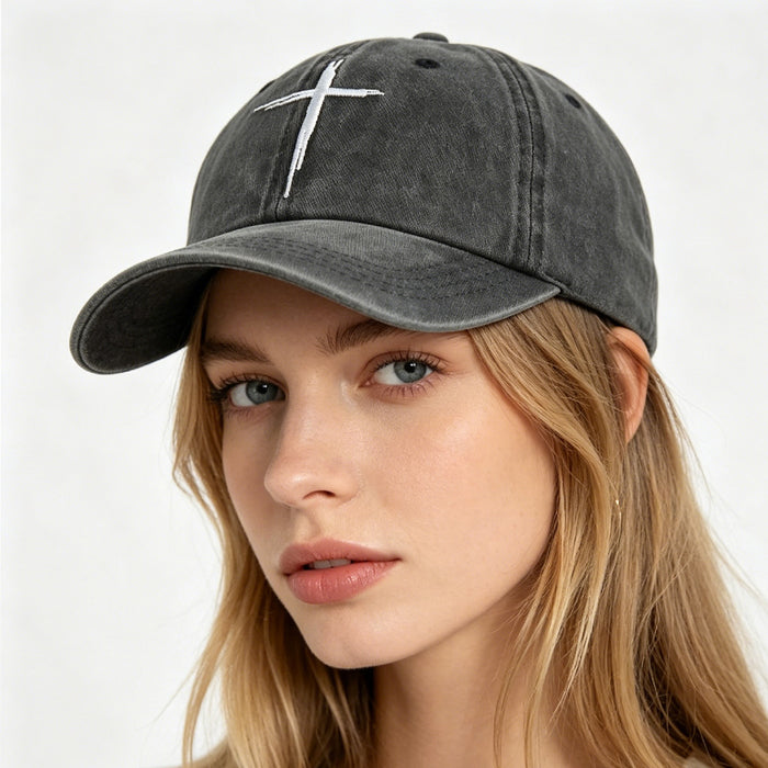 Distressed cotton hat in black with minimal front embroidery on a clean white background