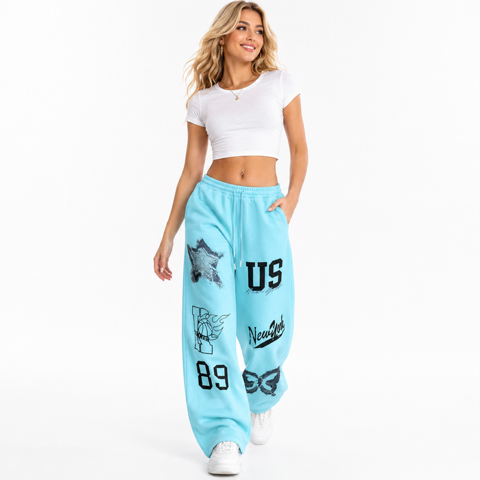 Wide leg sweat pants for women with digital printed pattern, relaxed harem fit, mid-waist comfort and full-length casual fit.