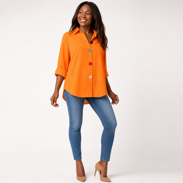 Orange women's button down shirt shown in a clean lifestyle studio pose with a relaxed silhouette and colorful buttons.