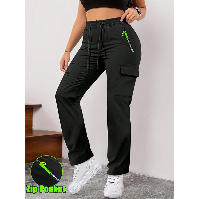 Black cargo pants with a green zipper pocket worn by a person on a plain background