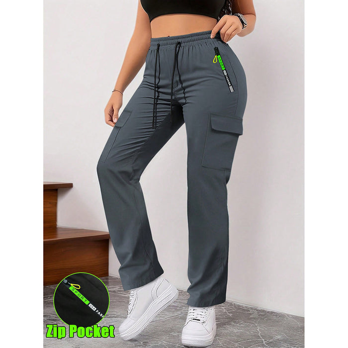 Person wearing gray cargo pants with a visible brand logo on a plain background