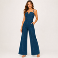 Women's dark blue wide-leg jumpsuit in an alternate full-body studio pose with the long silhouette fully visible.