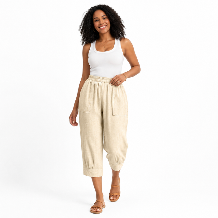 Women's relaxed cropped trousers in polyester with an elastic waist and large pockets for easy work, travel and weekend looks