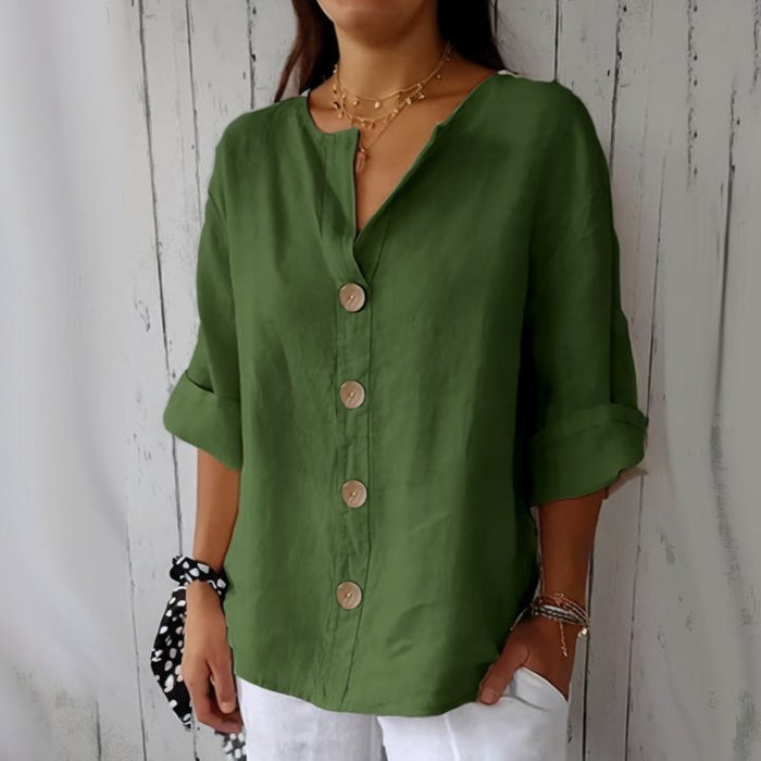close up loose fit women's v-neck linen button shirt wooden twist buttons premium hand feel fabric texture detail