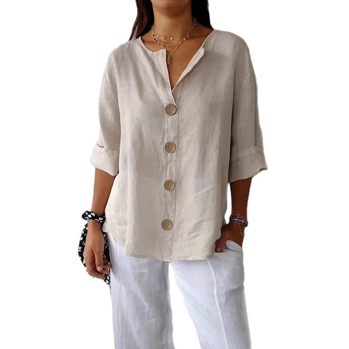 loose fit women's v-neck linen button shirt back view relaxed fit summer loose fit tunic natural wood wall