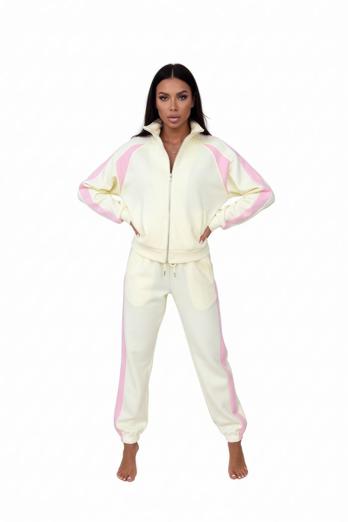 Side profile of orange polyester tracksuit set on a model, regular sleeve length, slim trouser cut